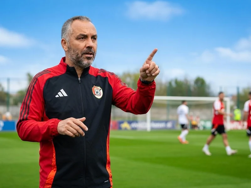 Frédéric Reculeau pointe du doigt sur le terrain de football