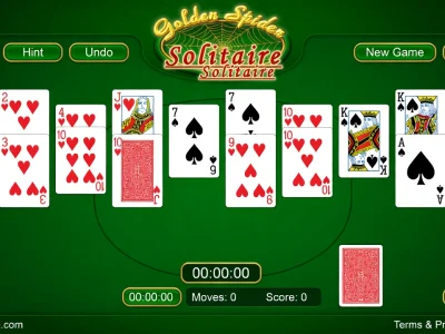 Une partie de golden Solitaire spider avec cartes étalées sur fond vert
