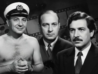 Léonide Moguy pose avec deux hommes devant des bobines de film